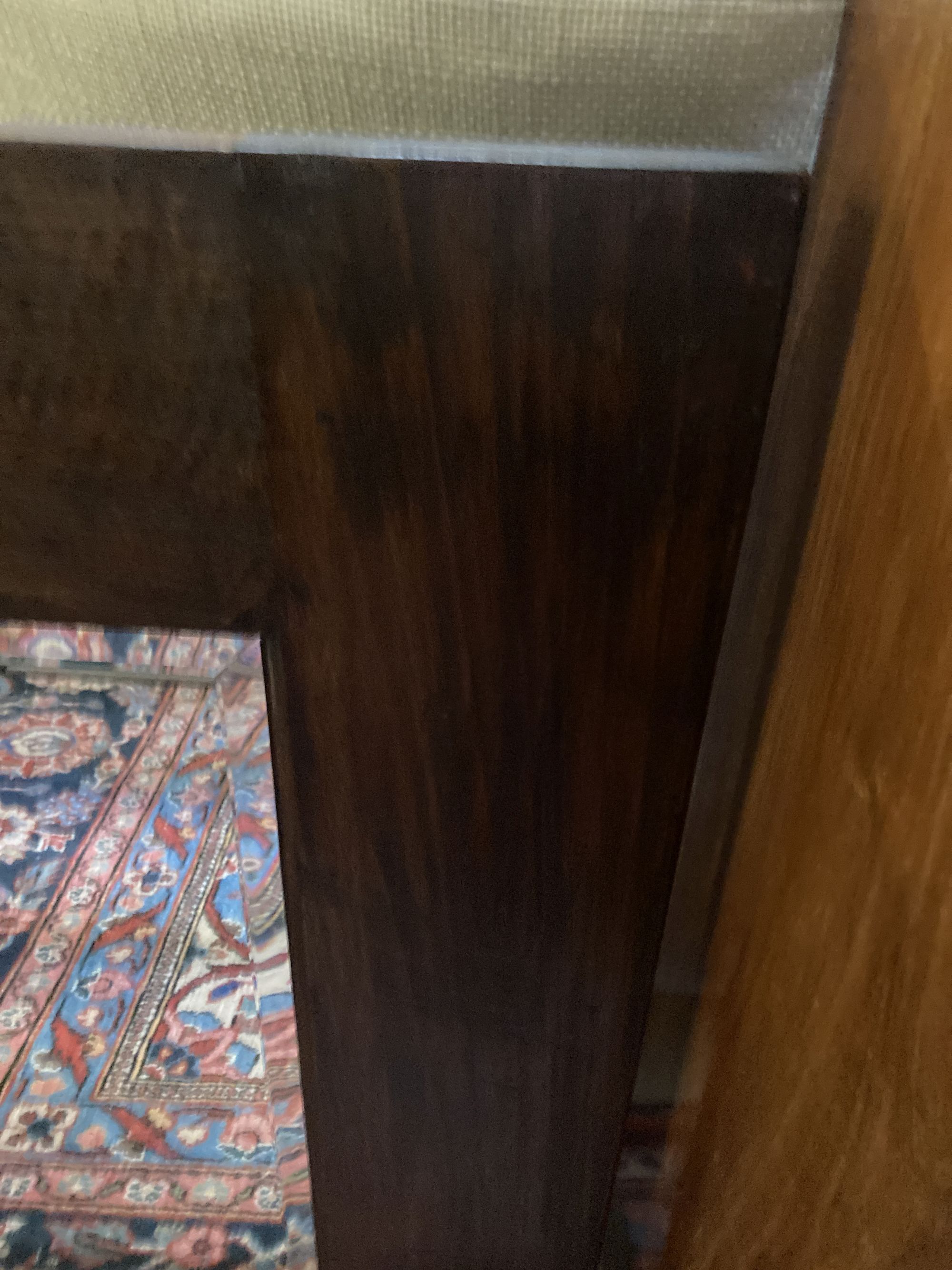 An Indian hardwood table, width 140cm, depth 40cm, height 76cm and a matching wall mirror
